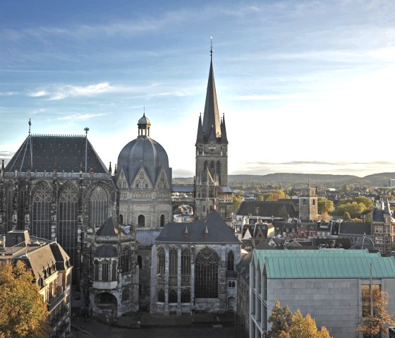 Aachen Cathedral at sunset, surrounded by the cityscape. The sky is clear with few clouds., © ats, B. Schroeder